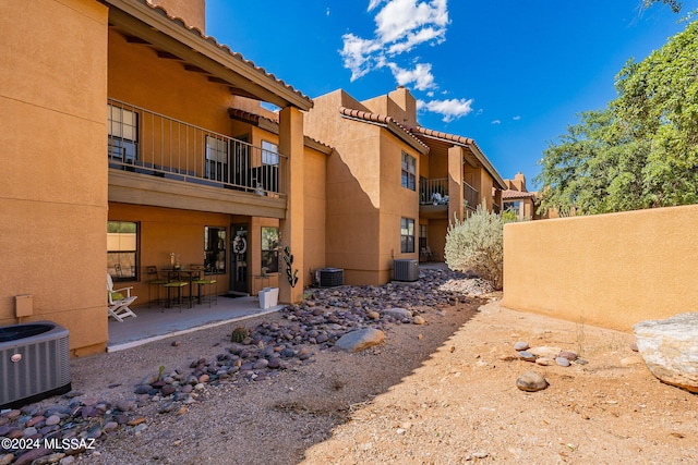 exterior space with a patio and central AC