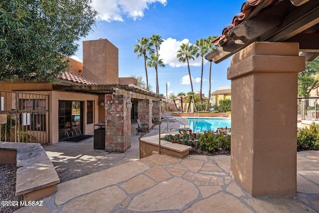 view of patio with a community pool