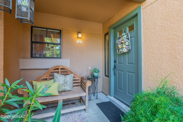 property entrance with covered porch