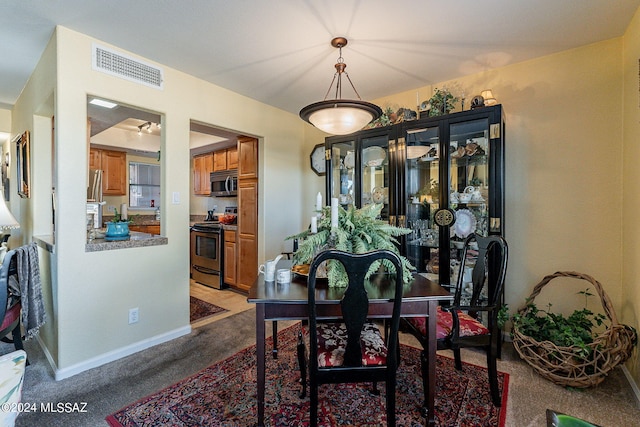 view of carpeted dining room