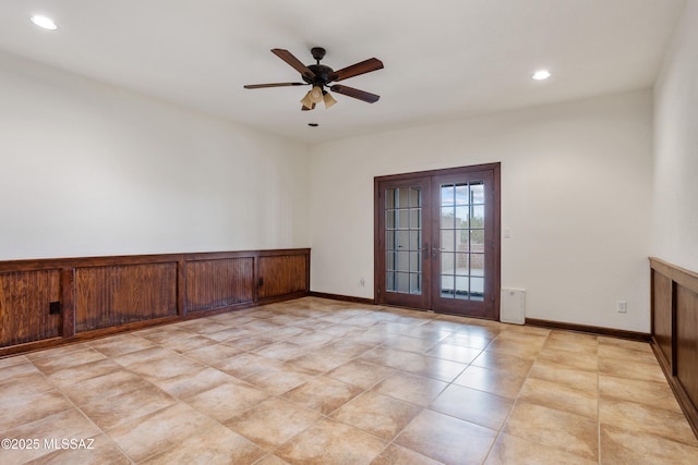 unfurnished room with french doors and ceiling fan