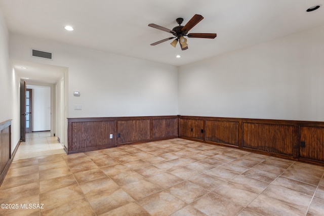 unfurnished room with ceiling fan