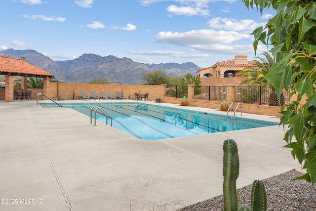 view of pool with a gazebo, a patio area, and a mountain view