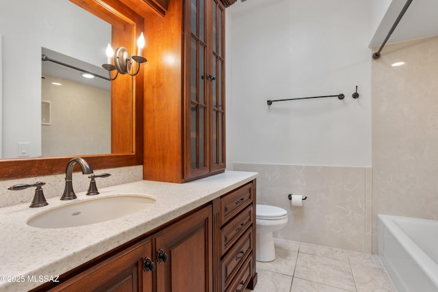 bathroom with tile patterned floors, vanity, and toilet