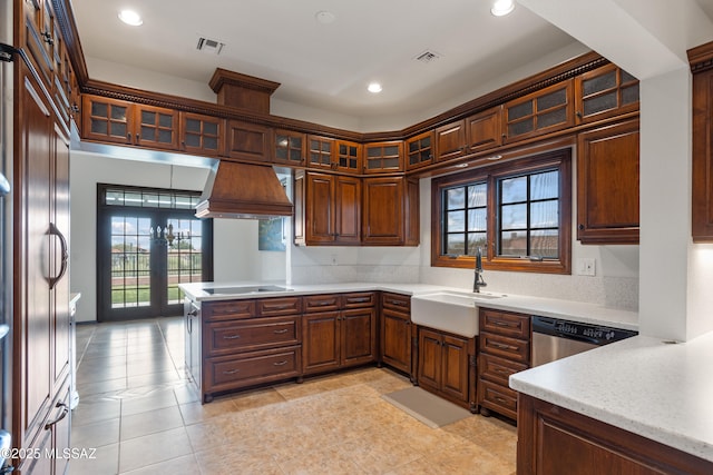 kitchen with sink, stainless steel dishwasher, kitchen peninsula, light tile patterned floors, and custom exhaust hood