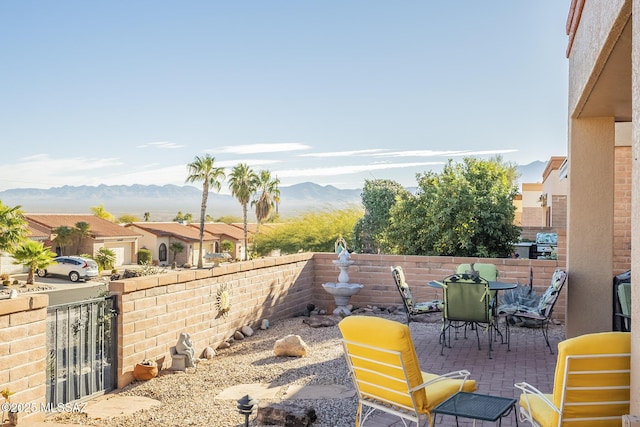 view of patio / terrace featuring a mountain view