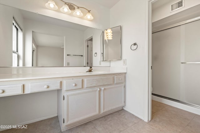 full bath with baseboards, visible vents, toilet, a shower with door, and vanity