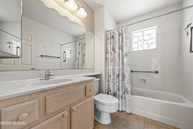 full bath with tile patterned flooring, vanity, toilet, and shower / bath combo with shower curtain