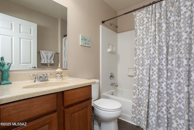 bathroom with tile patterned flooring, vanity, and toilet