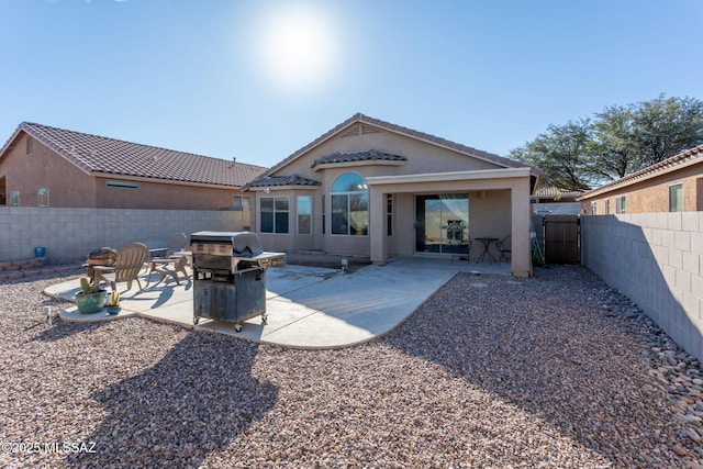 rear view of house with a patio area