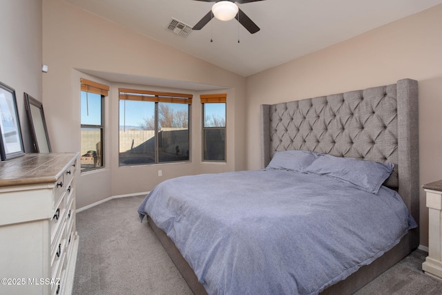 bedroom featuring ceiling fan, light carpet, and lofted ceiling