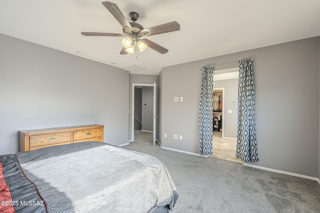 bedroom with ceiling fan and light colored carpet