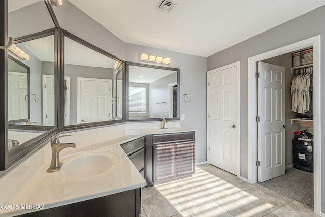 bathroom with tile patterned floors and vanity