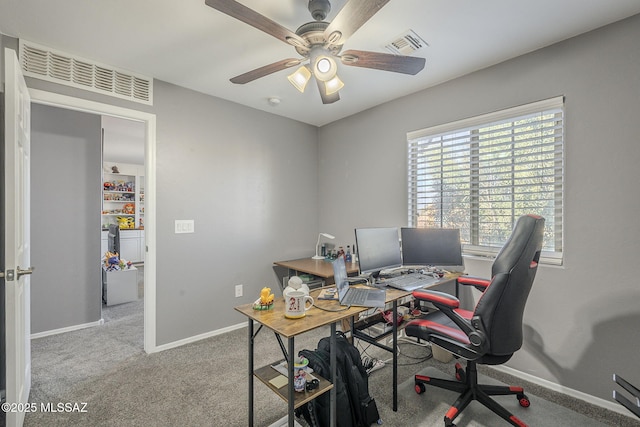 carpeted office with ceiling fan