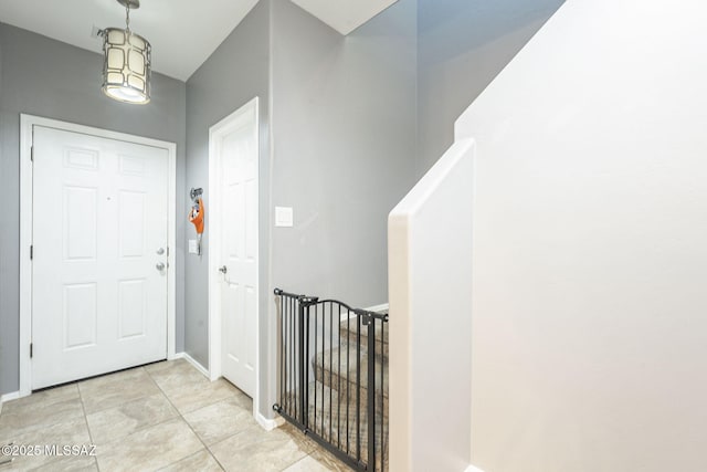 entryway featuring light tile patterned flooring