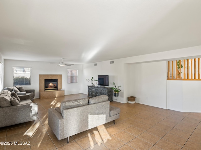 tiled living room featuring ceiling fan