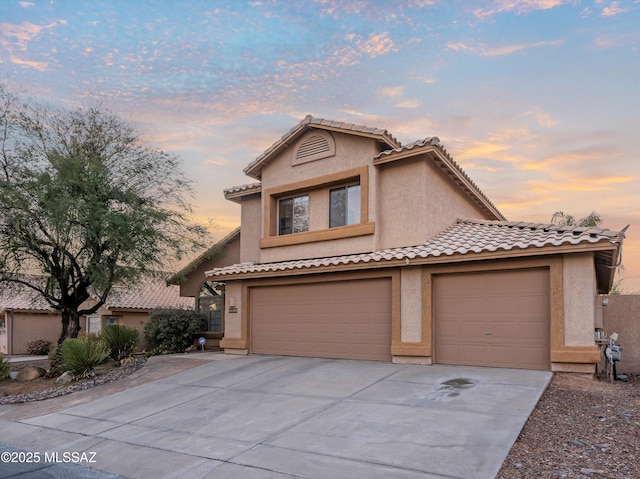 front facade with a garage