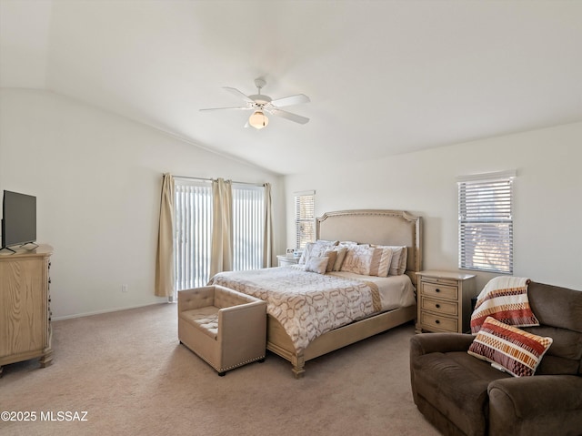 bedroom featuring ceiling fan, light carpet, and vaulted ceiling