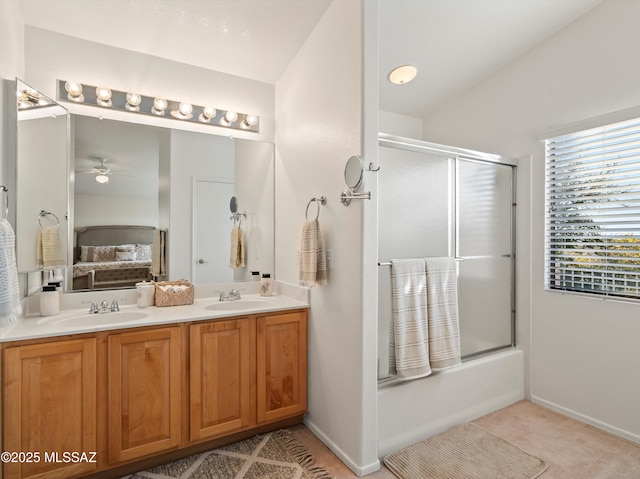 bathroom with ceiling fan, shower / bath combination with glass door, and vanity