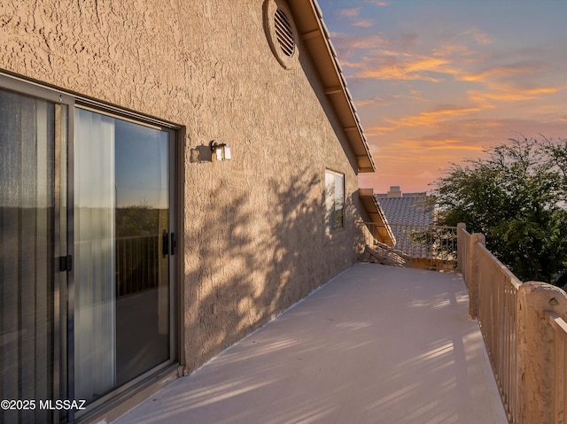 view of property exterior at dusk