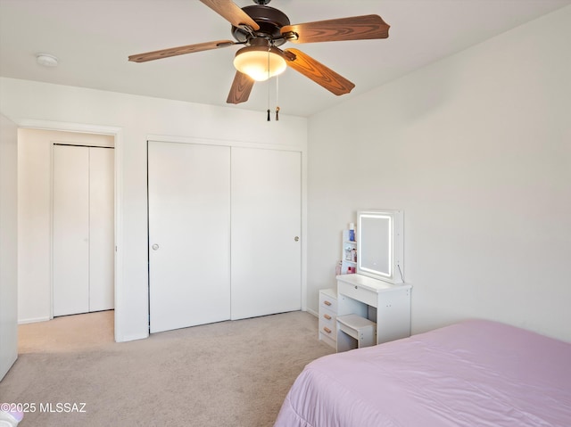 carpeted bedroom featuring ceiling fan