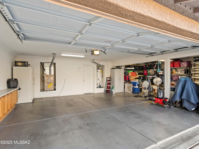 garage with gas water heater, white fridge, and a garage door opener