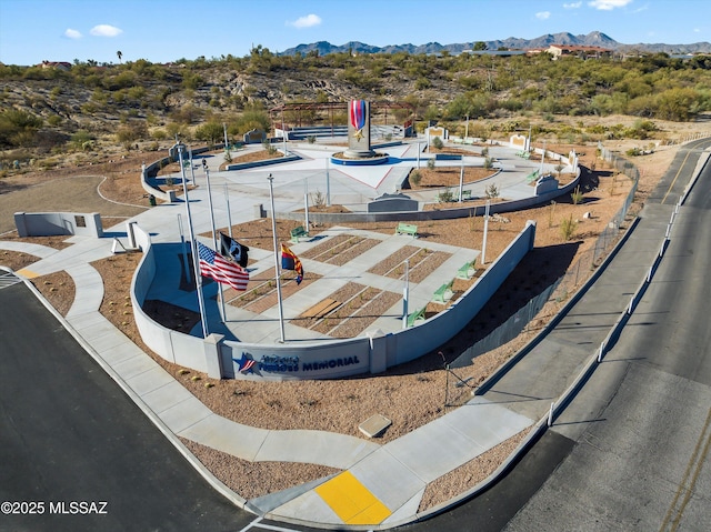 birds eye view of property with a mountain view