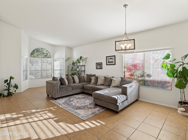 living room featuring an inviting chandelier and light tile patterned floors