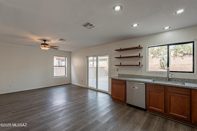 kitchen featuring visible vents, dishwasher, a sink, and open shelves