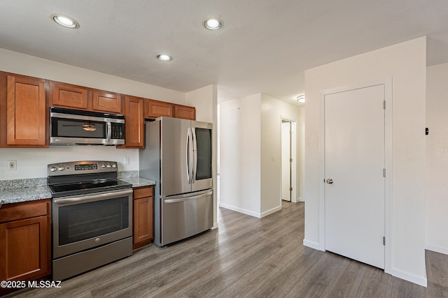 kitchen featuring appliances with stainless steel finishes and light wood-type flooring