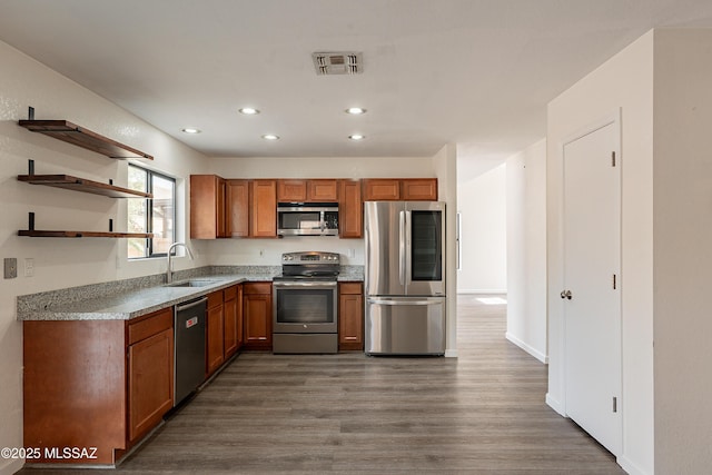 kitchen featuring sink, dark wood-type flooring, and stainless steel appliances