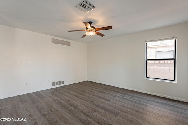 unfurnished room with dark hardwood / wood-style floors and ceiling fan