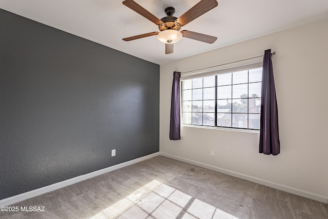 unfurnished room with ceiling fan and light colored carpet