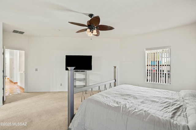 bedroom featuring ceiling fan and light colored carpet