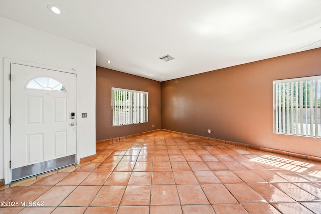 foyer entrance with light tile patterned floors