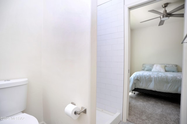 bathroom with walk in shower, ceiling fan, and toilet