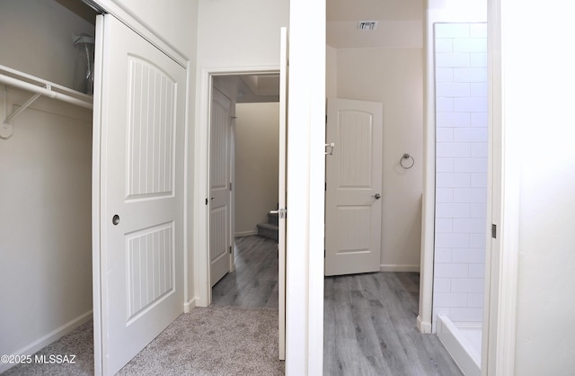 hallway with light wood-type flooring