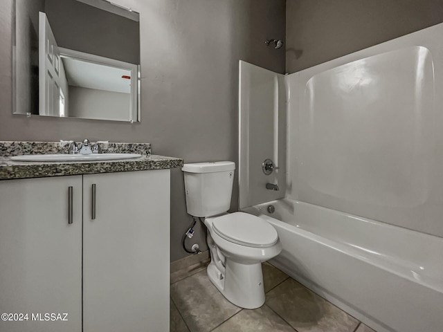 full bathroom featuring tile patterned floors, washtub / shower combination, vanity, and toilet