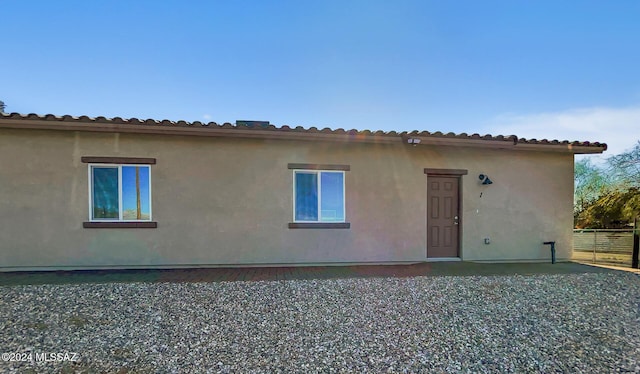 rear view of house featuring a patio