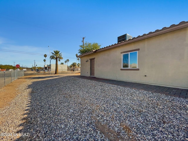 view of side of property with central AC unit