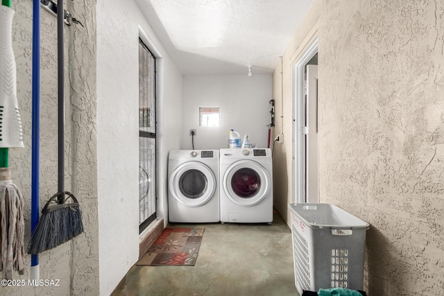 laundry room with independent washer and dryer