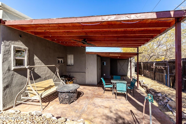 view of patio featuring ceiling fan