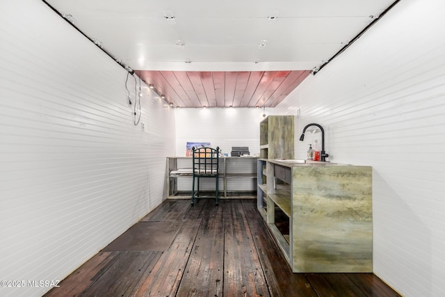 interior space featuring dark hardwood / wood-style flooring and sink