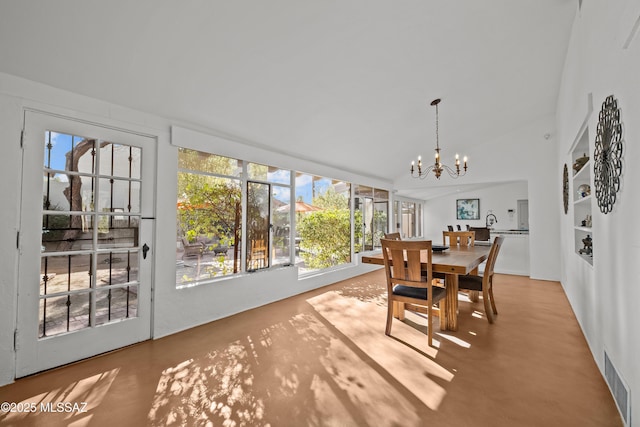 dining space with vaulted ceiling, visible vents, and a chandelier