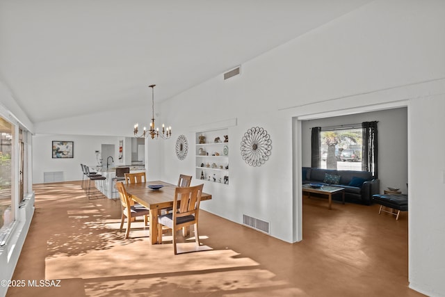 dining area featuring visible vents, a notable chandelier, and high vaulted ceiling