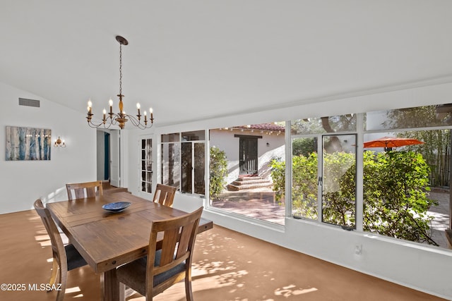 unfurnished dining area featuring a wealth of natural light, visible vents, an inviting chandelier, and vaulted ceiling