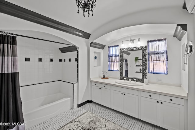 bathroom with vanity, tile patterned flooring, a healthy amount of sunlight, and shower / tub combo with curtain