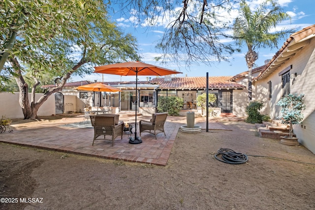 view of patio with outdoor lounge area and fence