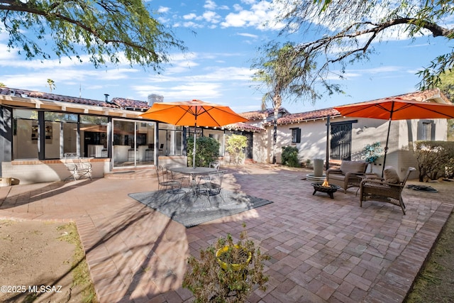 view of patio / terrace with a fire pit