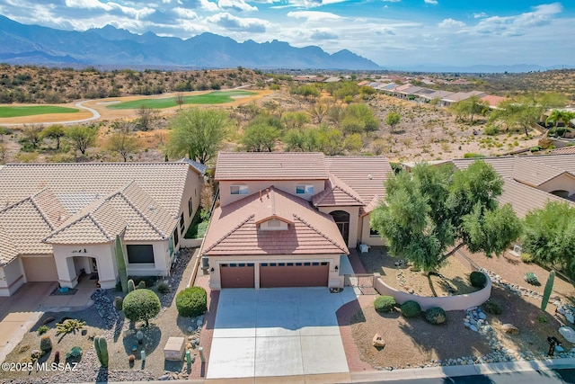 birds eye view of property featuring a mountain view